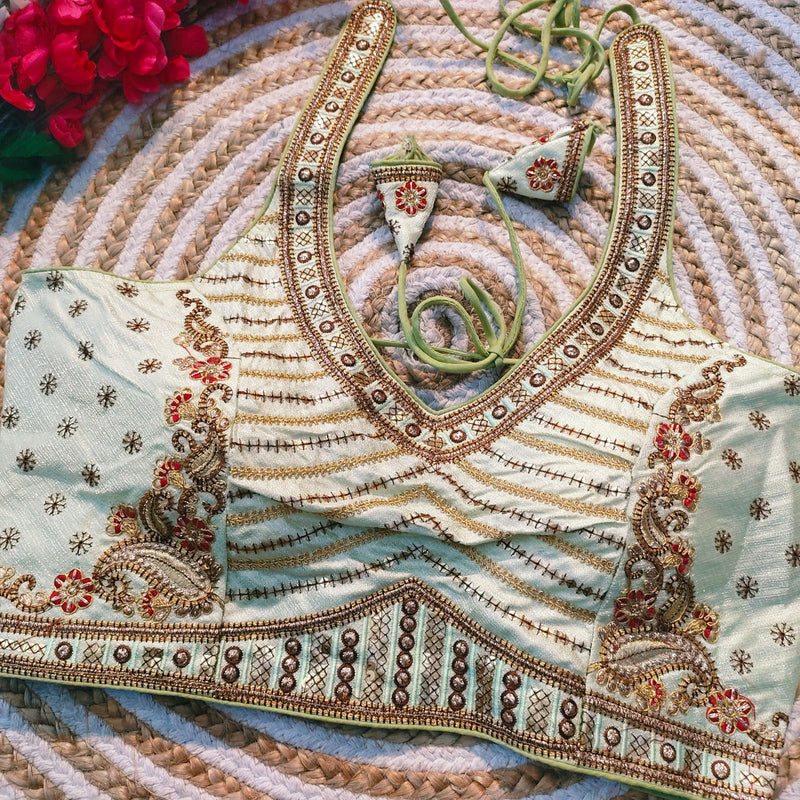 Beautiful embroidery all over cover with hand touch up sequence with heavy coding work in blouse