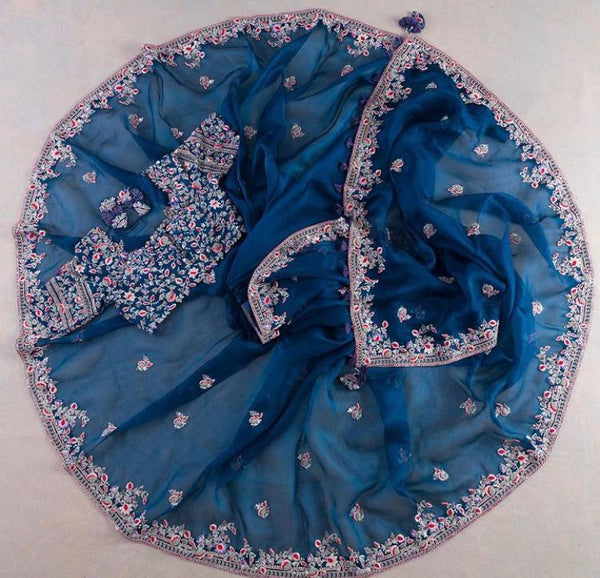Premium wedding designer saree in pure rangoli silk fabric with luxurious multi-thread embroidery work