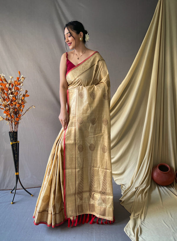 Cotton Sarees with Gold Zari Weaving Motifs all over having Beautiful Motifs all over. Rich Weaving Gold Zari Beautifully Designed Pallu. Paired with Brocade Weaving Blouse.