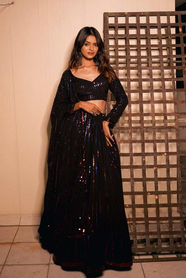 The Glamorous Georgette  Black designer Lehenga is an ode to all things fine and exquisite.  Specially Designed To Wear In Wedding, Functions And Special Occasions.
