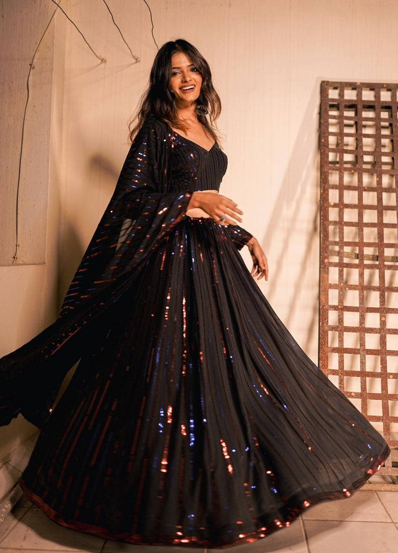 The Glamorous Georgette  Black designer Lehenga is an ode to all things fine and exquisite.  Specially Designed To Wear In Wedding, Functions And Special Occasions.