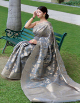 Linen Silk Sarees with Gold and Silver Zari Jaal Weaves all over, crafted with Zari Border and Rich Designed Weaving Pallu. Paired withÂ Unstitched Plain Blouse