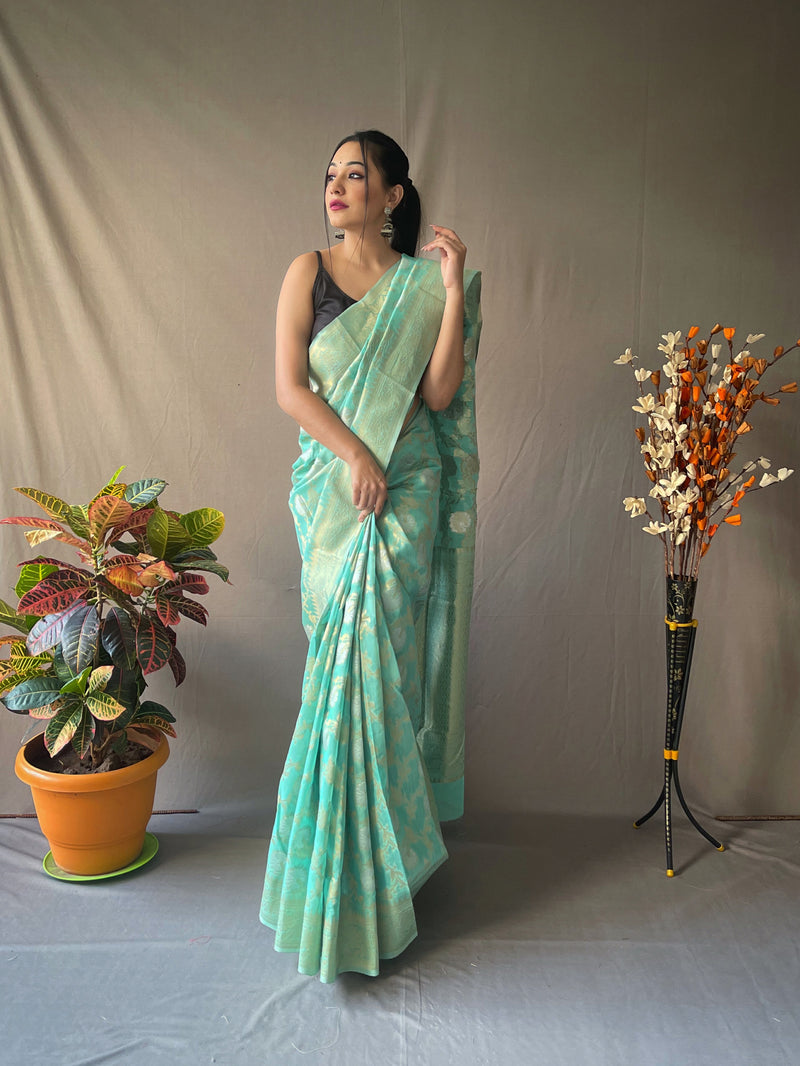Linen Silk Sarees with Gold and Silver Zari Jaal Weaves all over, crafted with Zari Border and Rich Designed Weaving Pallu. Paired with  Unstitched Plain Blouse
