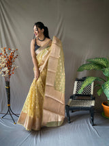 ORGANZA WEAVING SAREE WITH GOLD ZARI WEAVING MOTIFS ALL OVER HAVING RICH WEAVING PALLU. PAIRED WITH UNSTITCHED BROCADE BLOUSE