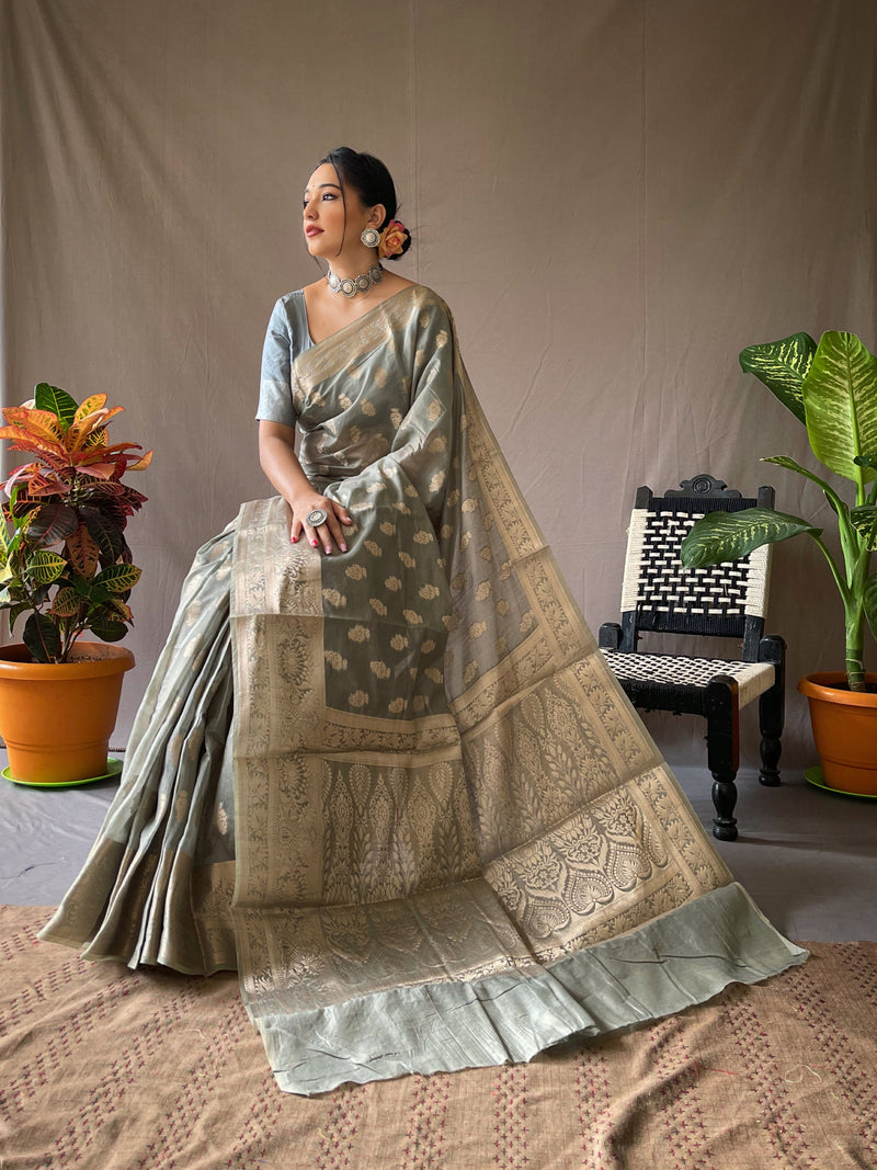 Linen Silk Sarees having Gold Motifs all over crafted with Rich Weaving Pallu Paired with Brocade Weaving Unstitched Blouse.