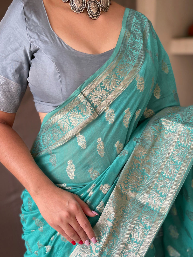 Linen Silk Sarees having Gold Motifs all over crafted with Rich Weaving Pallu Paired with Brocade Weaving Unstitched Blouse.