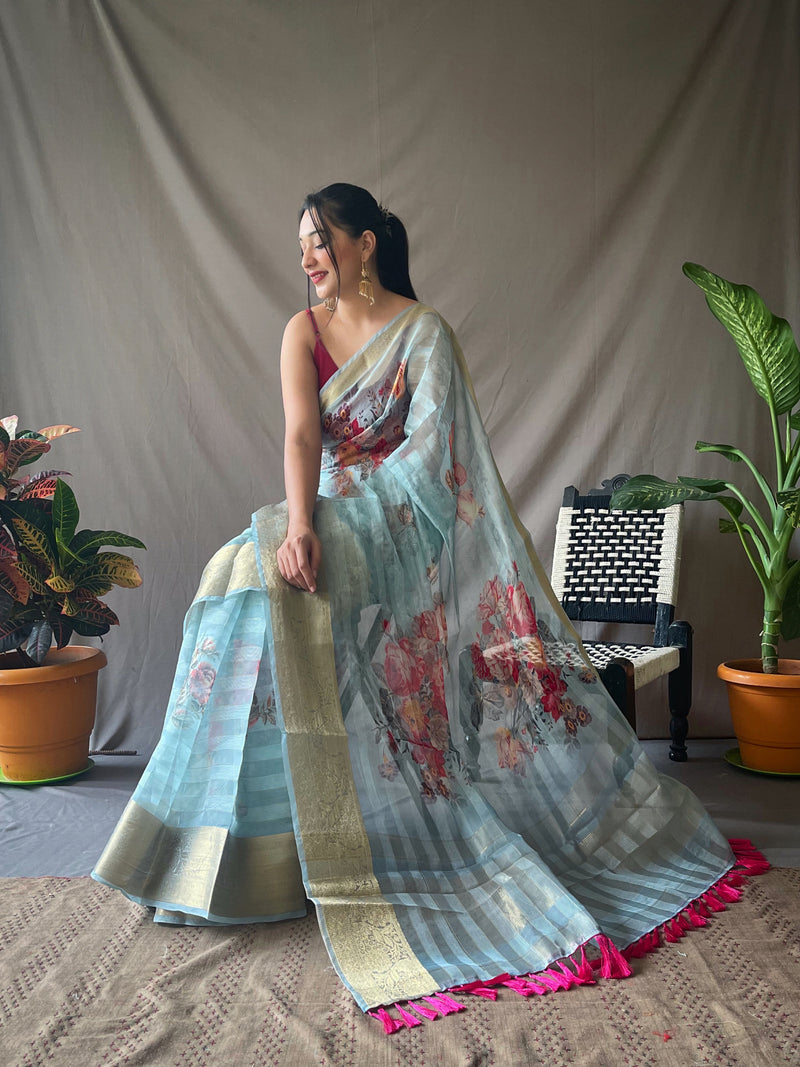 ORGANZA STRIPES FLORAL PRINTED SAREES WITH ELEGANT ZARI WEAVING PALLU AND JACQUARD WEAVING BORDER PAIRED WITH UNSTITCHED PRINTED BANGLORI SILK BLOUSE.