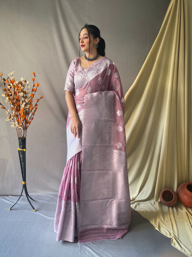 Beautiful Linen Silk Saree is having silver motif weaves all over the body of the saree , having silver zari woven Broad border and crafted with Elegant Silver Rich Woven Pallu.