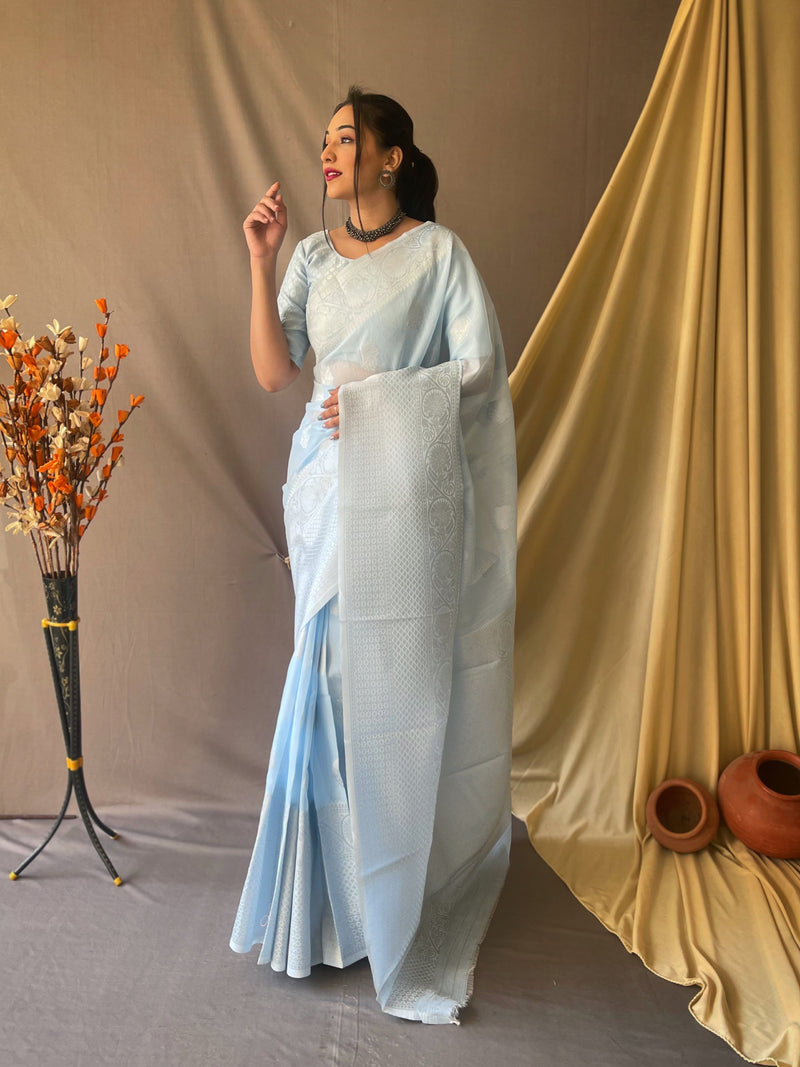 Beautiful Linen Silk Saree is having silver motif weaves all over the body of the saree , having silver zari woven Broad border and crafted with Elegant Silver Rich Woven Pallu.