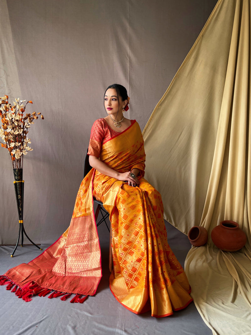 This beautiful Patola silk saree is having elegant meenakari bandhej weaves all over the body of saree, having gold zari decent woven border and crafted with elegant Zari Woven Pallu.